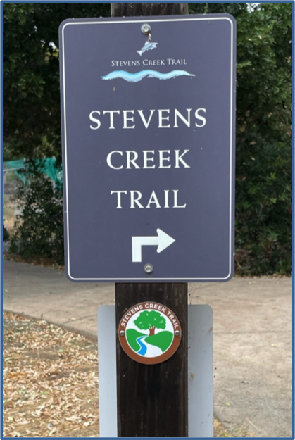 New trail medallion under an existing Cupertino Stevens Creek Trail sign